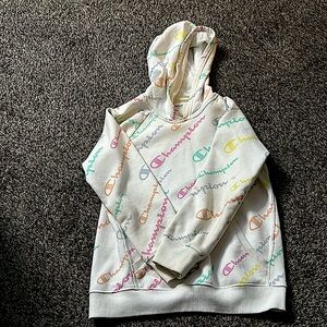 This is a white colorful champion hoodie
